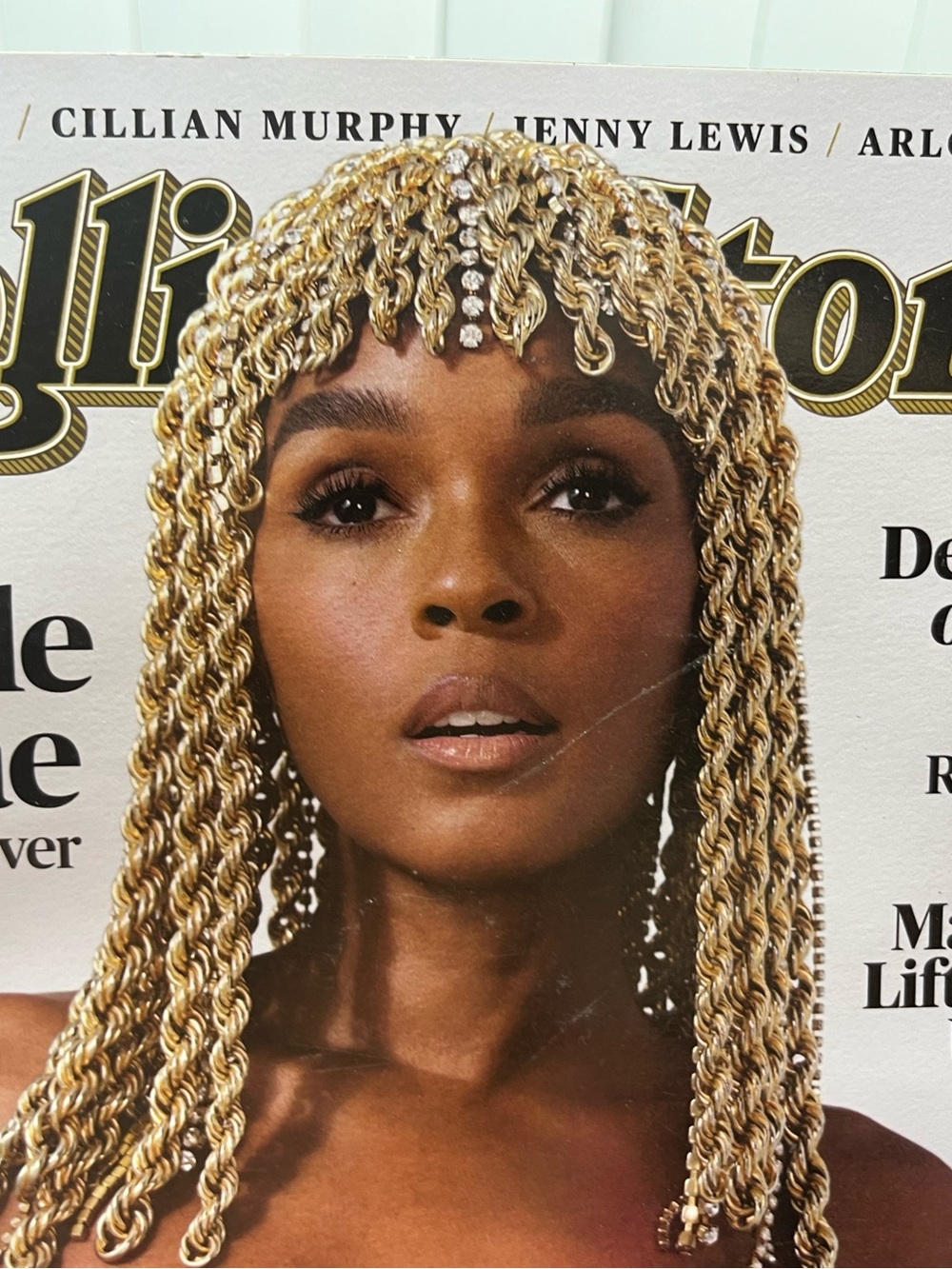 the Rolling Stones Gold Twist Braided Wig with Rhinestone Accent